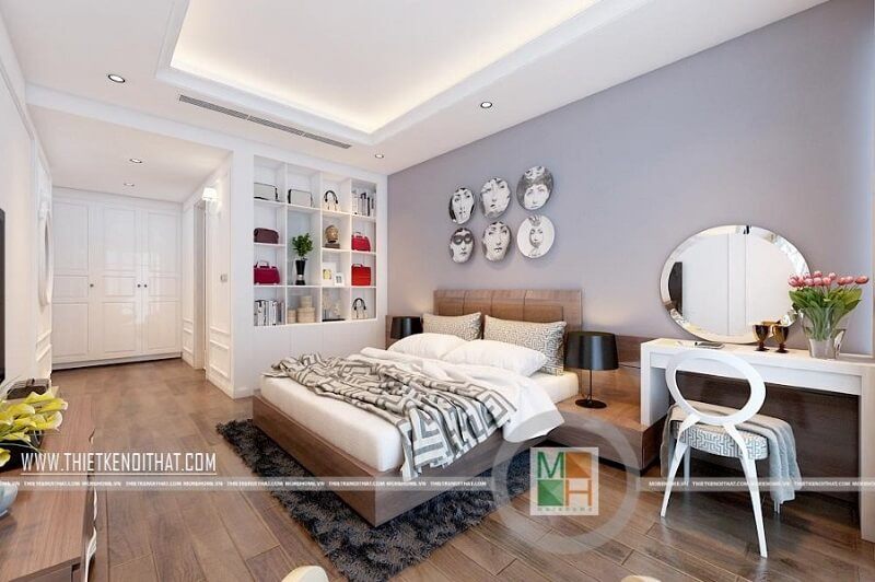 Trang trí phòng ngủ chung cư đẹp sử dụng đồ nội thất tông màu trắng chủ đạo kết hợp tranh treo tường ấn tượng mang đến sự sang trọng cho căn phòng.